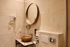 Koupelna v ubytování City Inn 24H Self Check-In by H&H Hotels