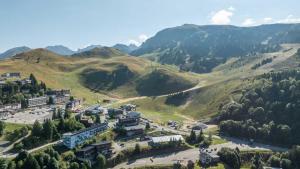 an aerial view of a resort in the mountains at Chalet des lupins - Chalet 1P2 in Chamrousse +10 photos