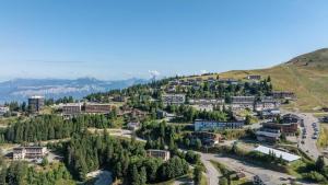 an aerial view of a city with trees and buildings at Chalet des lupins - Chalet 1P2 in Chamrousse