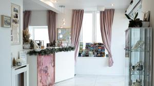 a living room with a counter and a window at The Feather's Hotel Newquay in Newquay