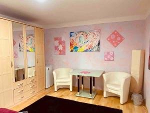 a dining room with a table and two chairs at Fun Franz for 6 Persons in Baldham