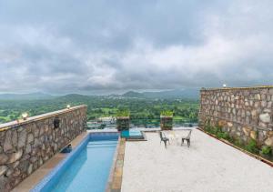 a swimming pool on top of a building at ALBA Mountain Villa's in Chirwa