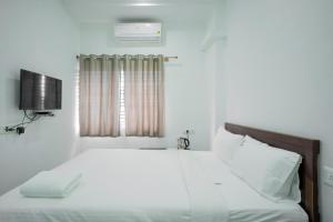 Postel nebo postele na pokoji v ubytování S S Hotels Bannerghatta