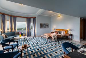 a living room with a bed and a couch at Villa Sol- A Hilltop Villa in Udaipur in Jāmb +75 photos