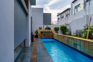 a swimming pool in the middle of a building at Cosy Corner Sandton in Vosburg