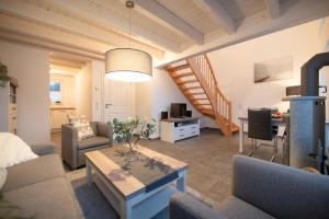 a living room with a couch and a table at VechteSonne - Nordhorn in Nordhorn