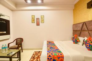 Ένα ή περισσότερα κρεβάτια σε δωμάτιο στο Via Delhi Continental