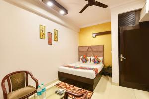 Ένα ή περισσότερα κρεβάτια σε δωμάτιο στο Via Delhi Continental