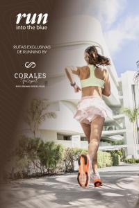 a woman walking down a street with a skateboard at Royal Hideaway Corales Beach - Adults Only in Adeje