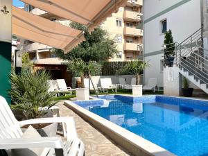 a swimming pool in the middle of a building at Apartments Pribilovic in Budva