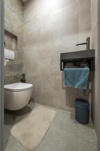 a bathroom with a tub and a toilet and a sink at Adela apartment in Košice +9 photos