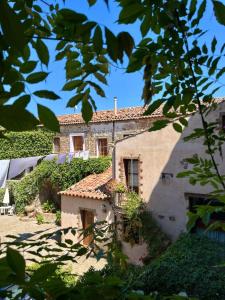 an external view of a building with ivy at Casa Bonomo in Castelbuono