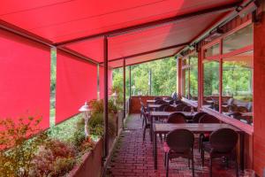 a row of tables and chairs on a patio at Hotel Scholz in Hitzacker