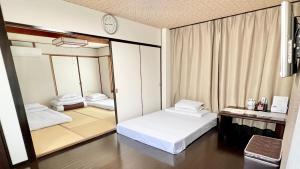 Giường trong phòng chung tại Reynaville 4F / Vacation STAY 2134
