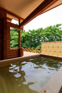 a pool of water on a patio of a house at Natural Retreat Mountain Blue / Vacation STAY 2336 in Hakusan