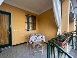 a table and chairs on the balcony of a house at Il Poggio nel verde in Varazze