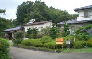 a house with a sign in front of it at Kakinoen / Vacation STAY 3939 in Nakagawa