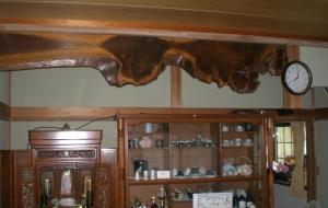 a wooden log on the ceiling of a room with a clock at Kakinoen / Vacation STAY 3939 in Nakagawa