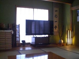 a living room with a large screen television in a window at Numazu - House - Vacation STAY 19568v in Numazu +7 photos