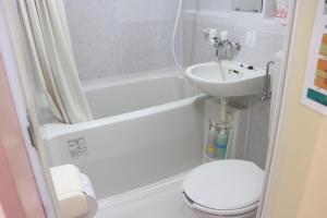 a bathroom with a toilet and a sink at The Hirosawa City Dome House West Building / Vacation STAY 6890 in Chikusei