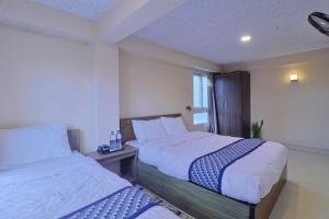 Giường trong phòng chung tại Hotel Kiba Nanee