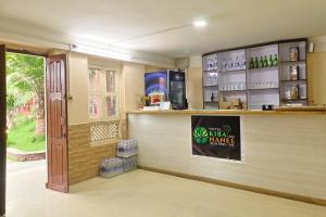a bar in a restaurant with a sign on the wall at Hotel Kiba Nanee in Bhaktapur