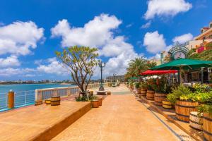 a walkway next to a body of water at Tsukasa Condo Chatan Alaha in Chatan