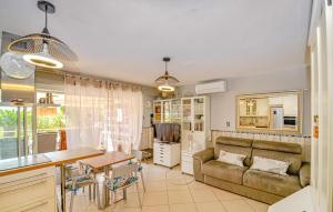 a living room with a couch and a table at Appt Face Mer in La Ciotat