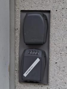 a box with a remote control sitting on a wall at Apartment Oulu station in Oulu