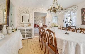 a kitchen and dining room with a table and chairs at Awesome Home In Humble With Wifi in Humble