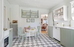 a kitchen with a table and a dining room at Awesome Home In Humble With Wifi in Humble