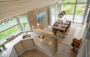 an overhead view of a kitchen and dining room with a table at 3 Bedroom Stunning Home In Kalundborg in Kalundborg