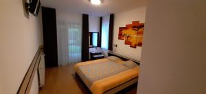a bedroom with a bed in a room at Pensiunea Fortuna in Sovata