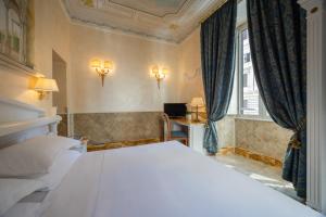 Кровать или кровати в номере Hotel Palladium Palace