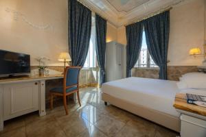 Кровать или кровати в номере Hotel Palladium Palace