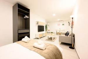 Ένα ή περισσότερα κρεβάτια σε δωμάτιο στο Elewana Suites