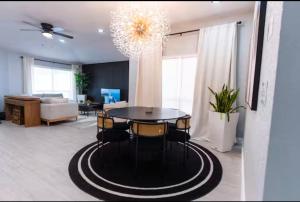 a living room with a table and a couch at Bloomsbury Dr in Kissimmee