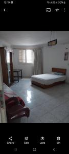 a room with a bed and a chair in it at Female privat rooms cairo center in Cairo +25 photos