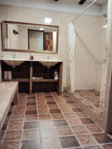 a bathroom with a sink and a mirror at Mas Campmol in Cistella