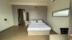 Ένα ή περισσότερα κρεβάτια σε δωμάτιο στο Tathastu Farm Stay +23 φωτογραφίες