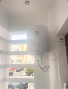 a white light in a room with a window at Appartement-suite- de standing 10 min de la plage in Agadir