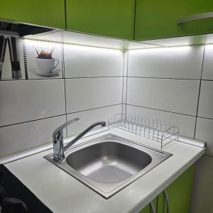 Kuchyň nebo kuchyňský kout v ubytování Apartament Zarnesti free parking VMP 2