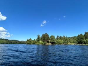 a view of a lake from a boat at Lommen in Dals Långed