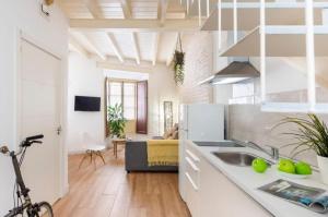a kitchen with a sink and a counter top at Bajo Gerona in Seville