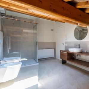 a bathroom with a glass shower and a sink at Antica Corte Lugo in Lugo +248 photos