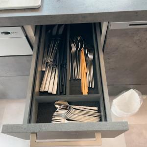 a drawer full of utensils in a cabinet at Le Repos軽井沢 in Karuizawa