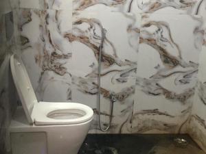 a bathroom with a toilet and a shower at d3 avanti vihar in Raipur +33 photos
