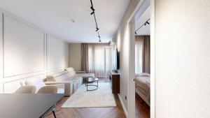 a living room with a couch and a table at Ideal Apartments in Banja Luka