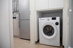 a white washer and dryer in a kitchen at Artianna, holiday home in Alinda, Leros in Alinda