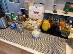 a counter with a box of honey and other items at Pension Jitřenka Hřensko in Hřensko